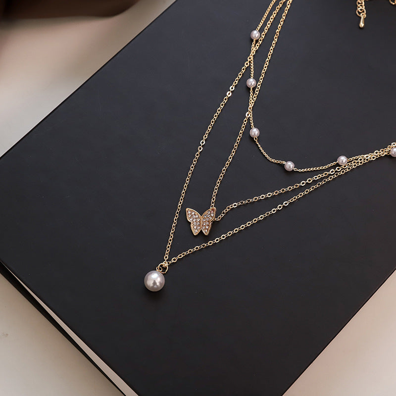 Multi-layered butterfly pearl necklace