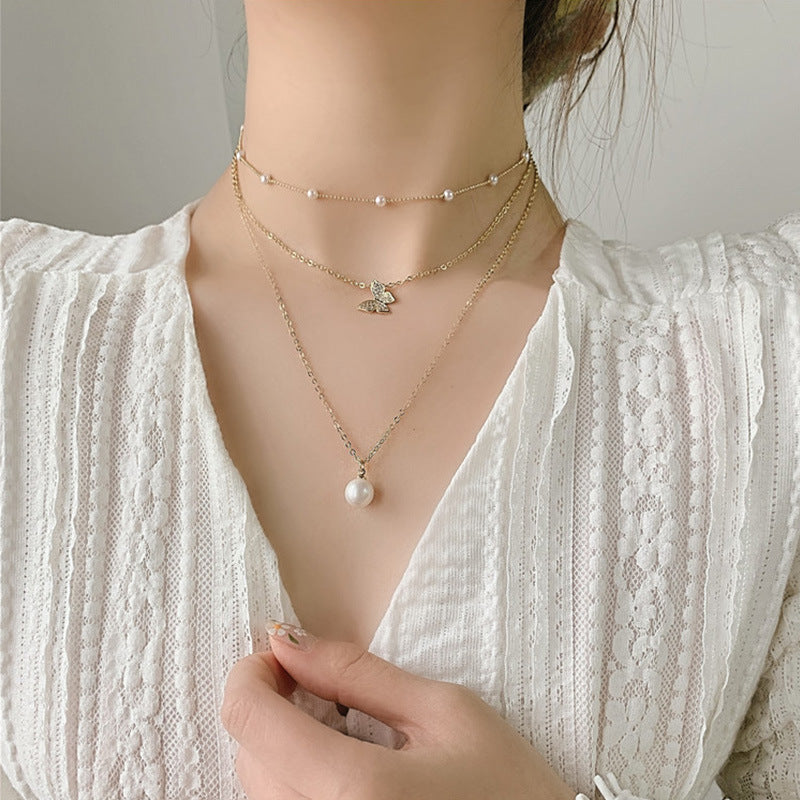 Multi-layered butterfly pearl necklace