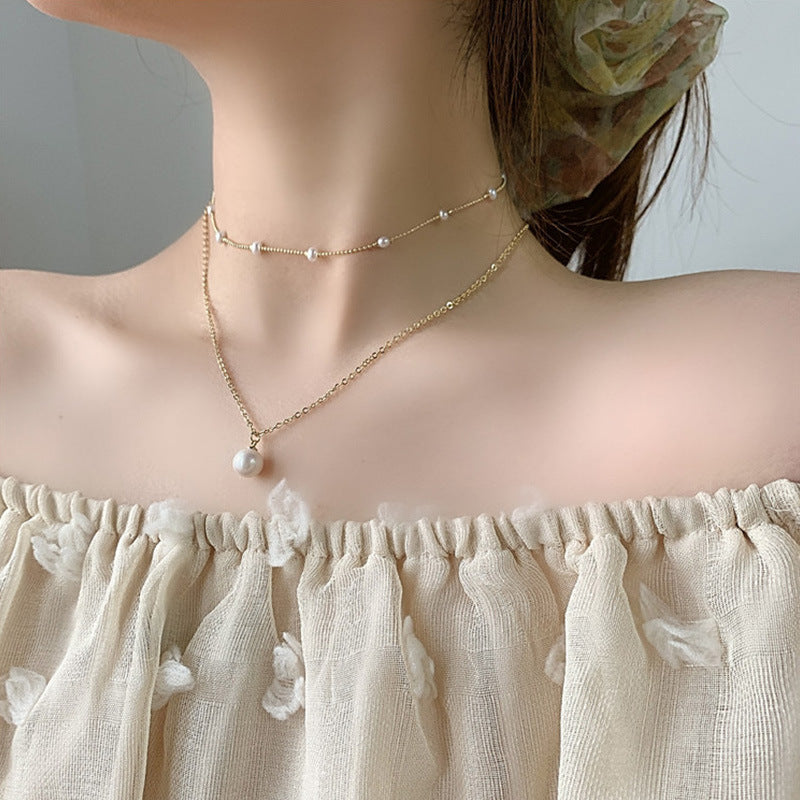Multi-layered butterfly pearl necklace