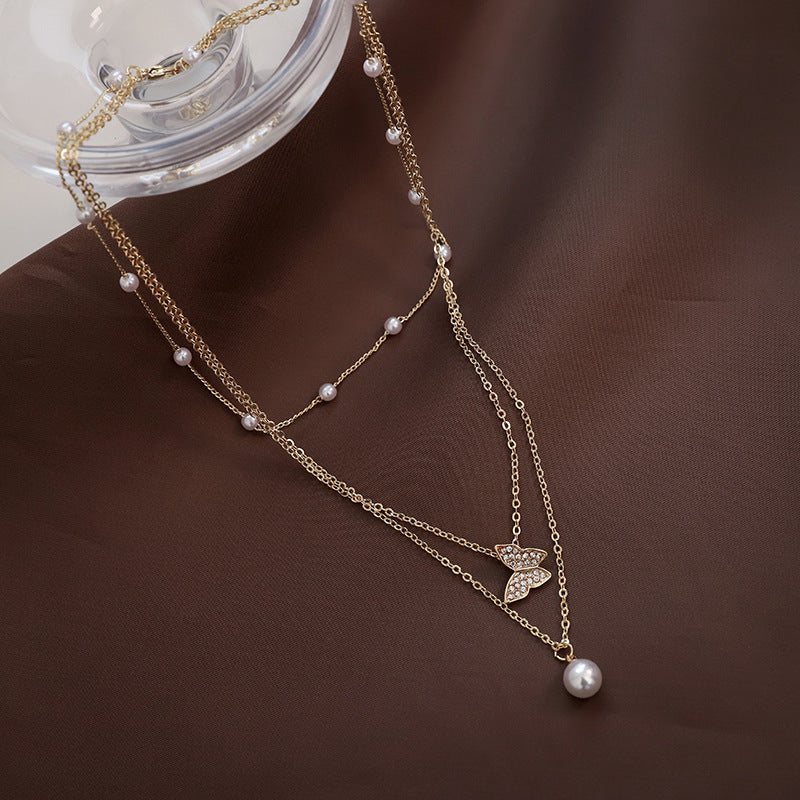 Multi-layered butterfly pearl necklace