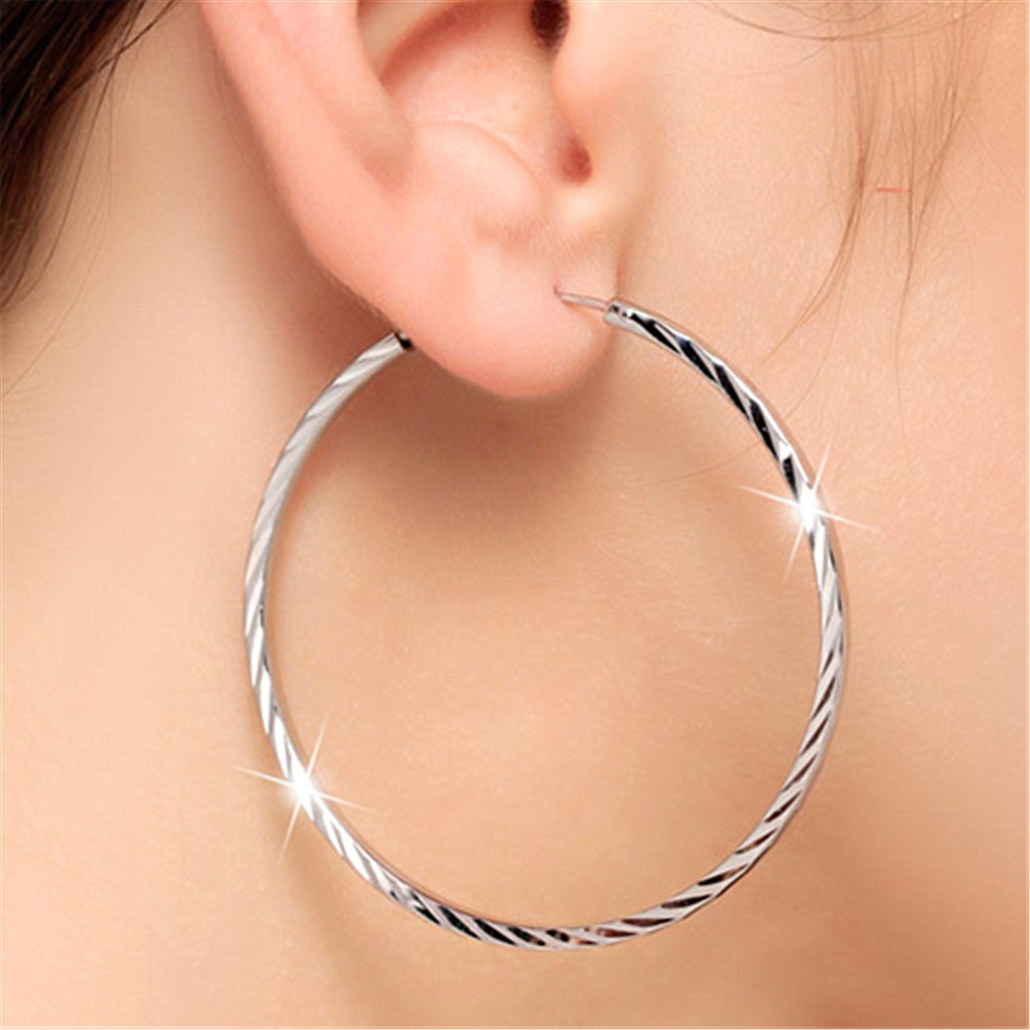 Exaggerated big ear hoop earrings with silver ornaments