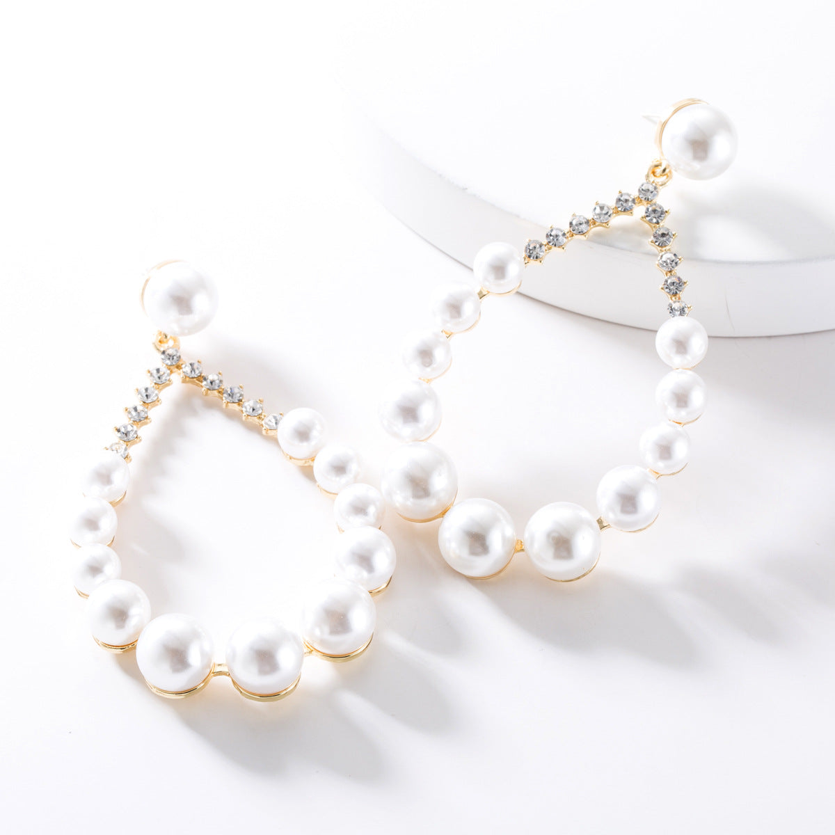 Diamond imitation pearl earrings