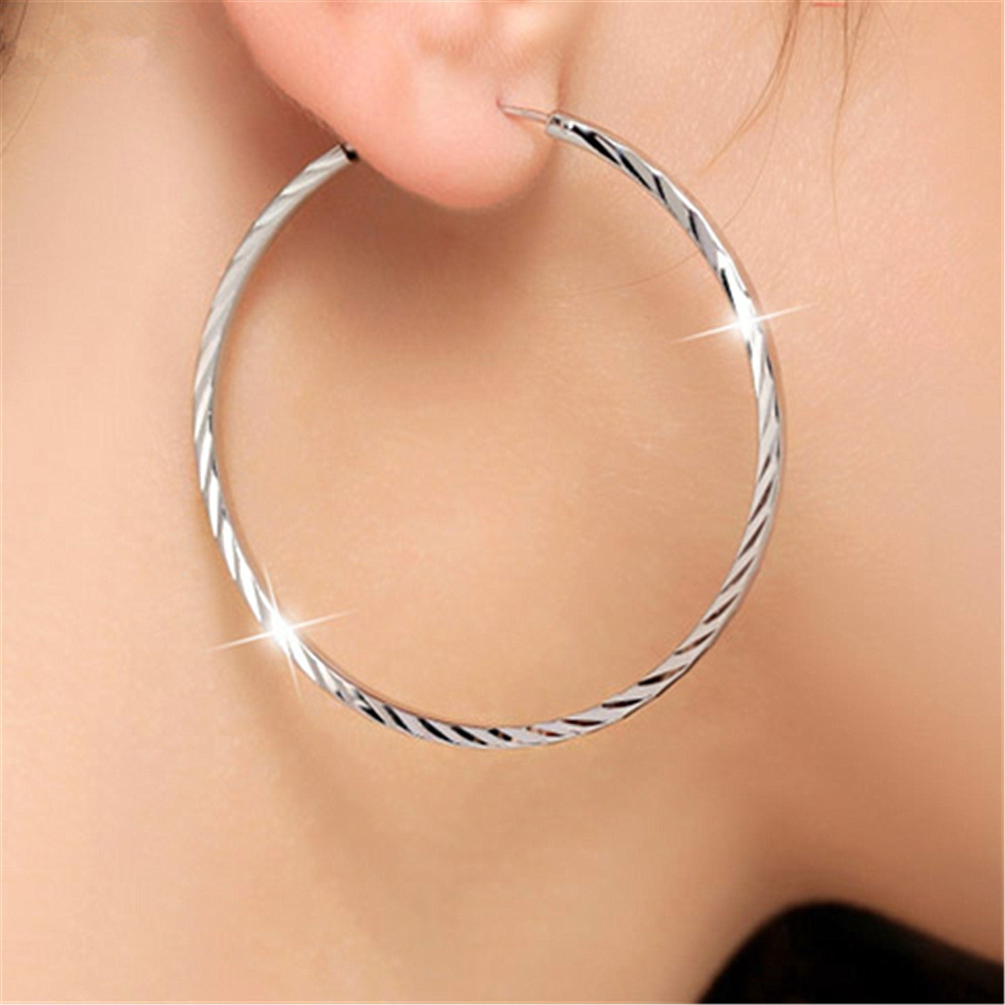 Exaggerated big ear hoop earrings with silver ornaments