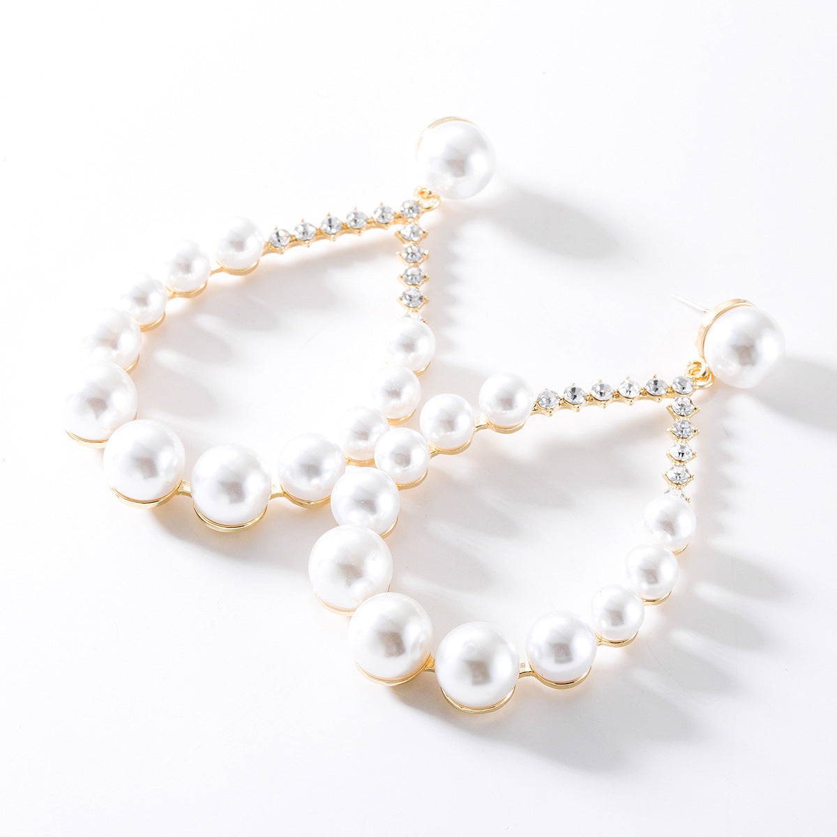 Diamond imitation pearl earrings