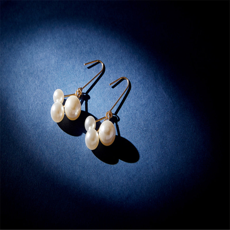 Women's asymmetric pearl earrings