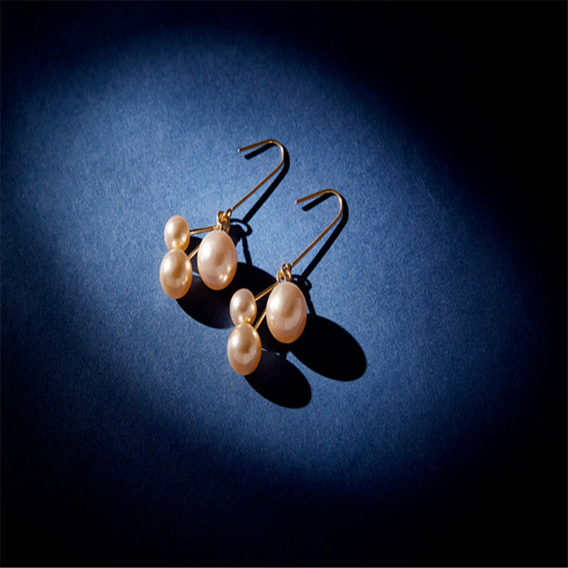 Women's asymmetric pearl earrings