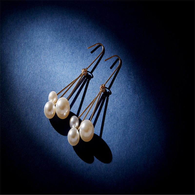 Women's asymmetric pearl earrings