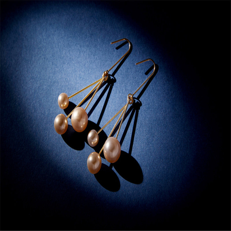 Women's asymmetric pearl earrings